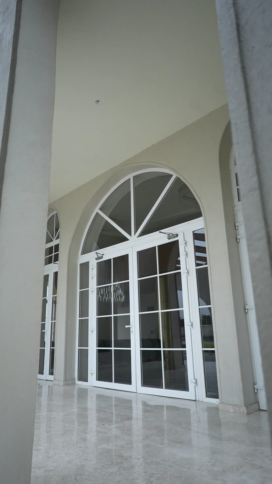 Clubhouse with Arched Glazing by Rudratech — uPVC installation detail 4