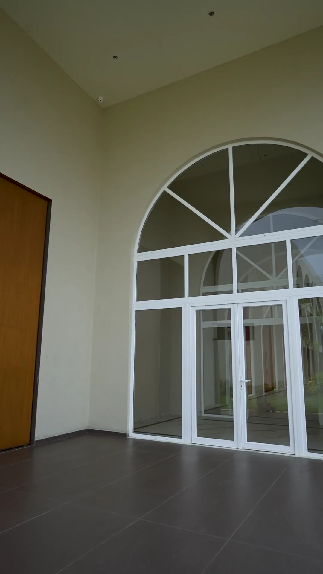 Clubhouse with Arched Glazing by Rudratech — uPVC installation detail 8