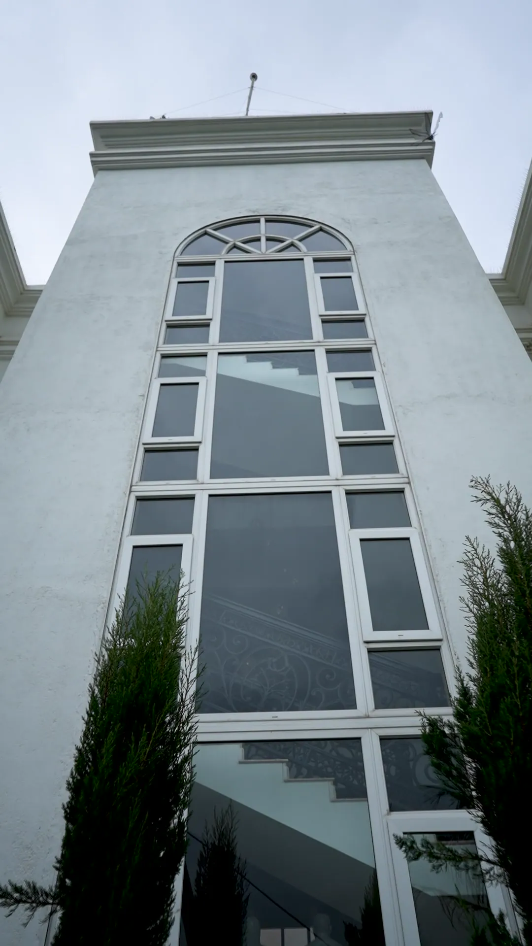 Luxury Villa with Arched Windows by Rudratech — uPVC installation detail 4