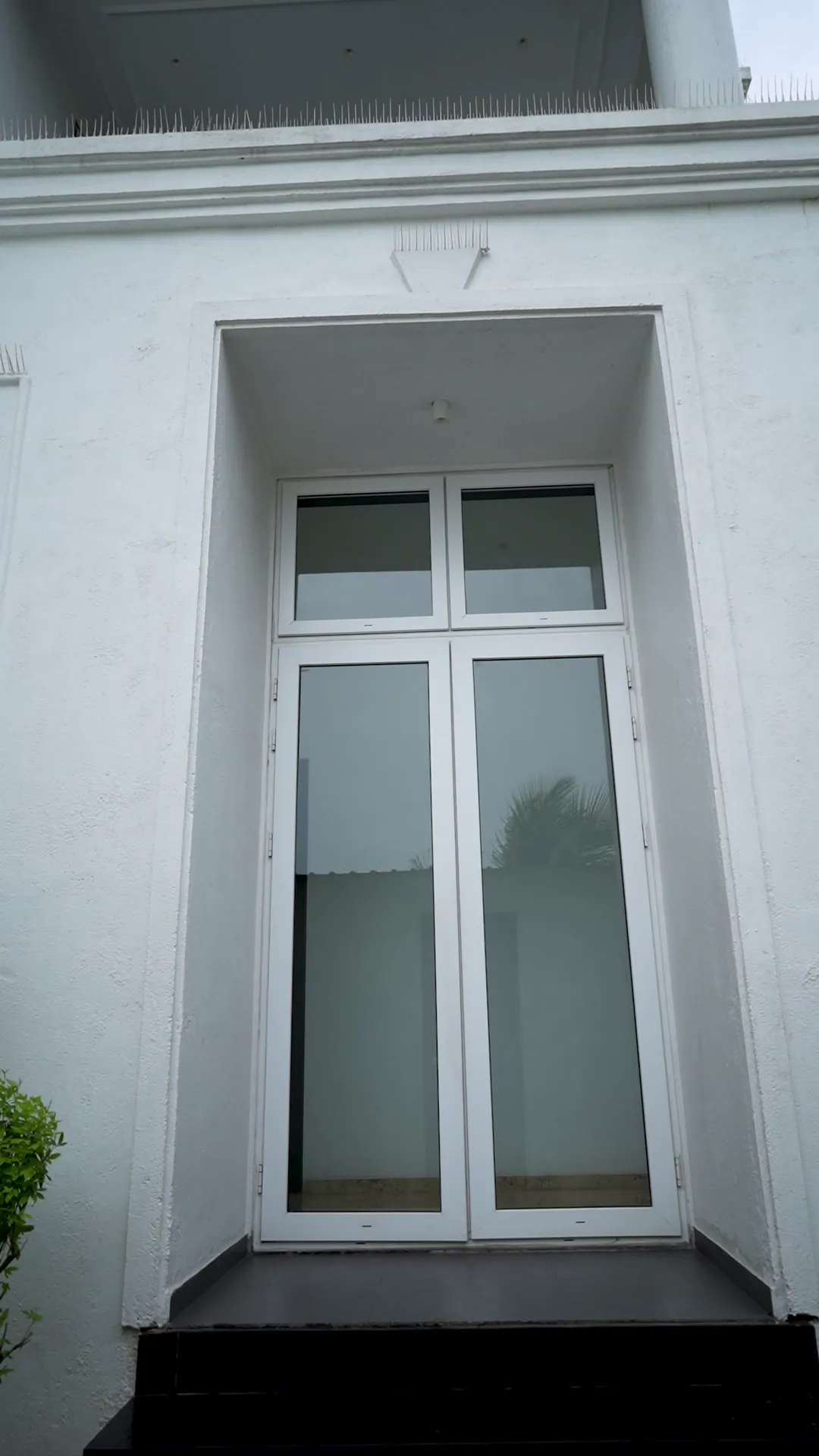 Luxury Villa with Arched Windows by Rudratech — uPVC installation detail 5
